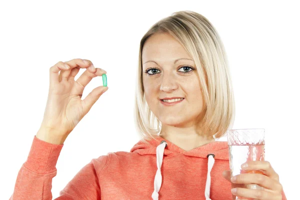Girl holds a pill — Stock Photo, Image