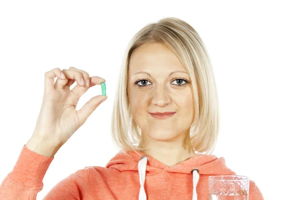 Chica sostiene una píldora —  Fotos de Stock