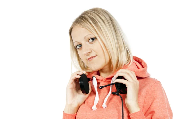 Щаслива дівчина тримає навушники ізольовані — стокове фото