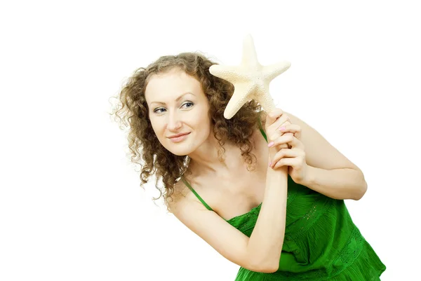 Menina feliz com a estrela do mar — Fotografia de Stock