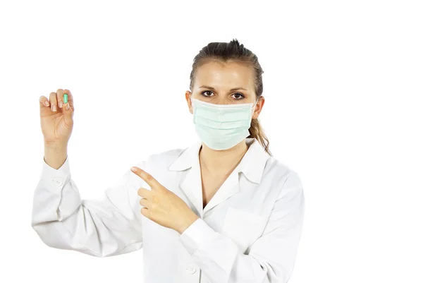 Enfermera con una máscara sostiene una tableta aislada —  Fotos de Stock