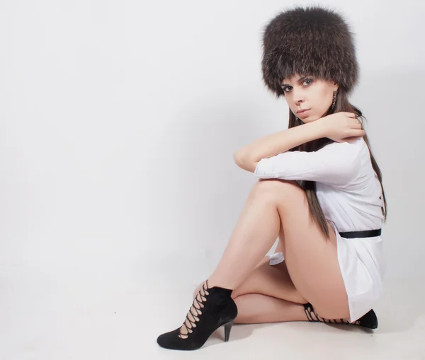 Girl in a fur hat — Stock Photo, Image