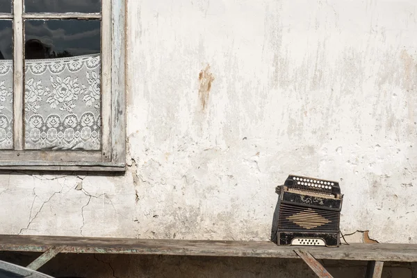 Wall and accordion on the bench background — Stock Photo, Image