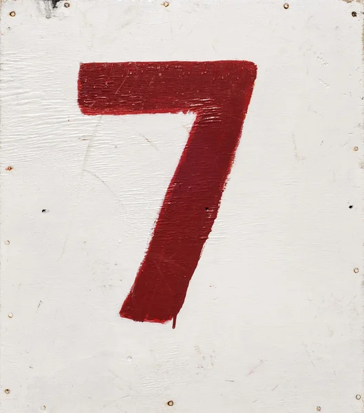 Αριθμός επτά σε φόντο λευκό κόντρα πλακέ — Φωτογραφία Αρχείου