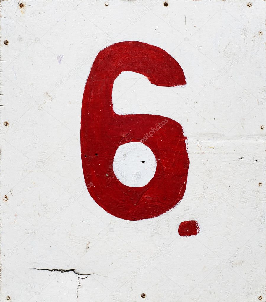 Number six on white plywood background