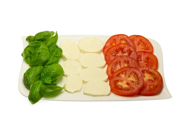 Tomate, hojas de albahaca fresca y mozzarella. Bandera de Italia . — Foto de Stock