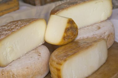 Different sorts of cheese at a market .(Provence, France) clipart