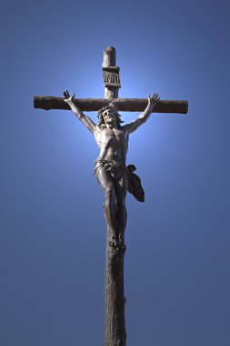 Statue of Jesus Christ on a cross clipart