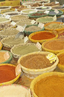 Various kinds of spices at market clipart