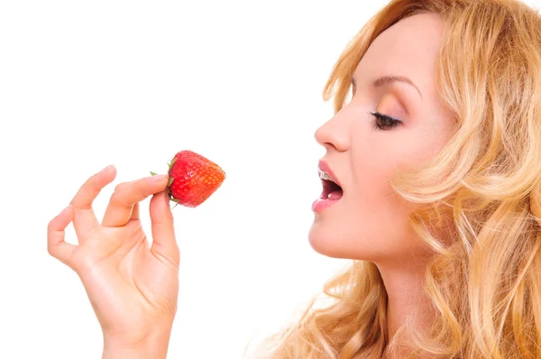 Girl eating strawberries — Zdjęcie stockowe