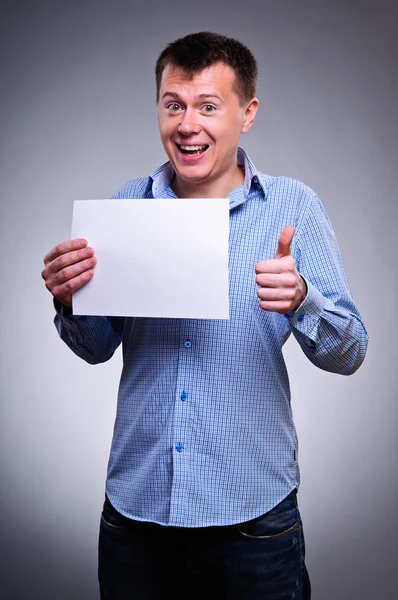 Business man holding a blank — Stock Photo, Image