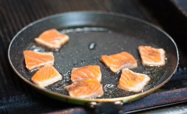 Fish is fried in a skillet — Stock Photo, Image