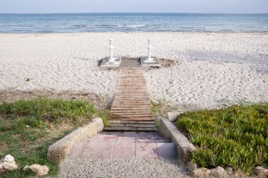 Wooden access footpath to the beach clipart
