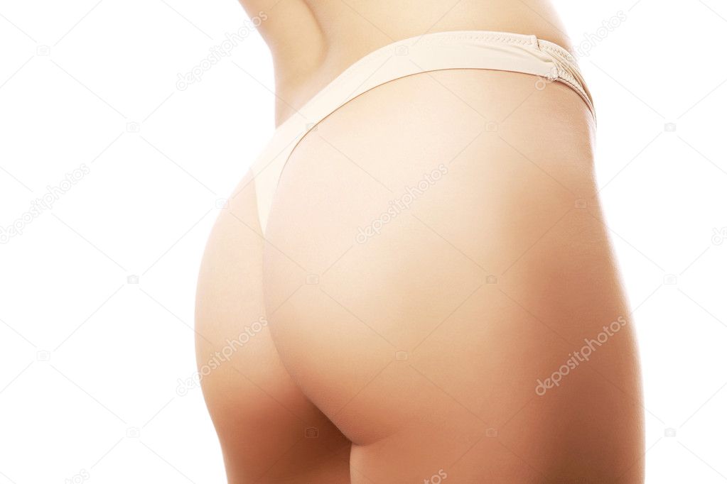Beautiful female buttocks in beige panties