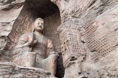 Buddha statue at the Yungang Caves, China clipart