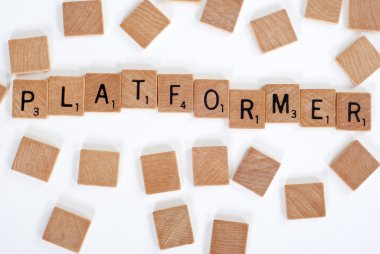 Scrabble tiles spell out 'Platformer' clipart