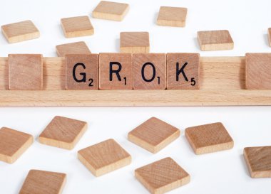 Scrabble tiles spell out 'Grok' clipart