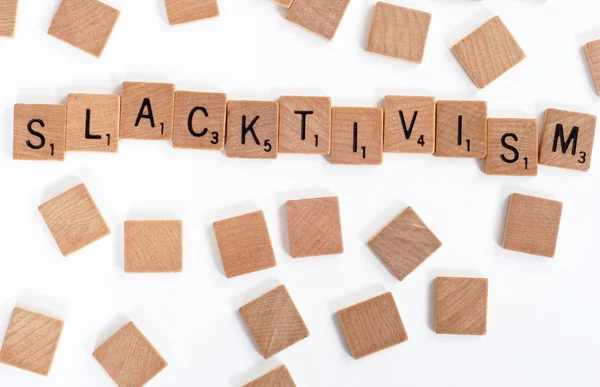 Scrabble tiles spell out 'Slacktivism' — 图库照片