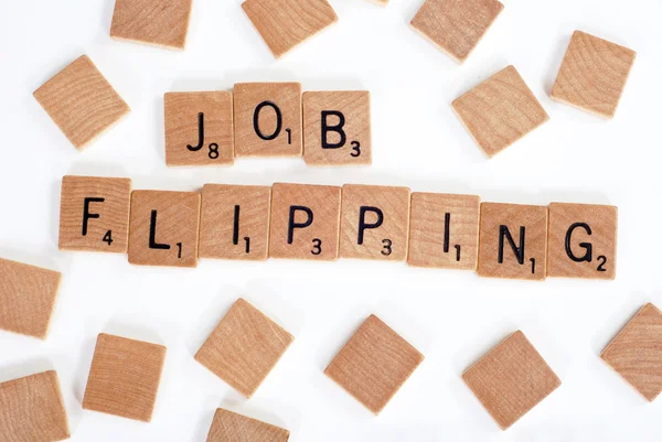 Scrabble tiles spell out 'Job Flipping'