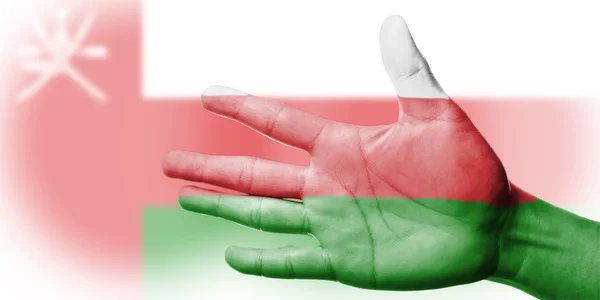 Азия Аплодируя вентилятор с картиной Оман национальный флаг с вашей рукой — стоковое фото