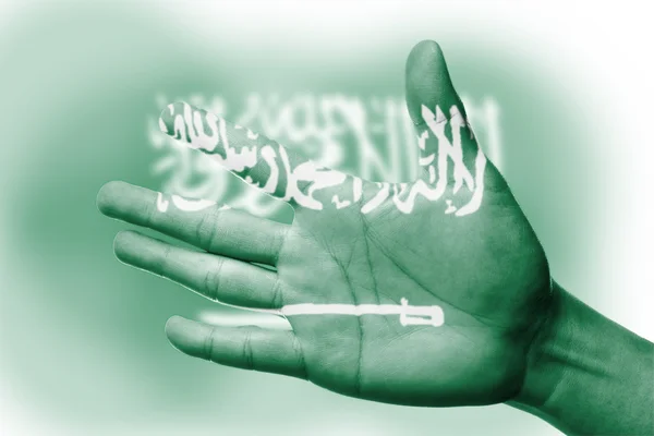 Ásia torcida com pintura bandeira nacional da Arábia Saudita — Fotografia de Stock