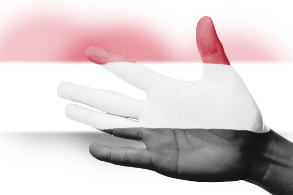 Ásia torcida com pintura bandeira nacional do Iêmen com a mão — Fotografia de Stock
