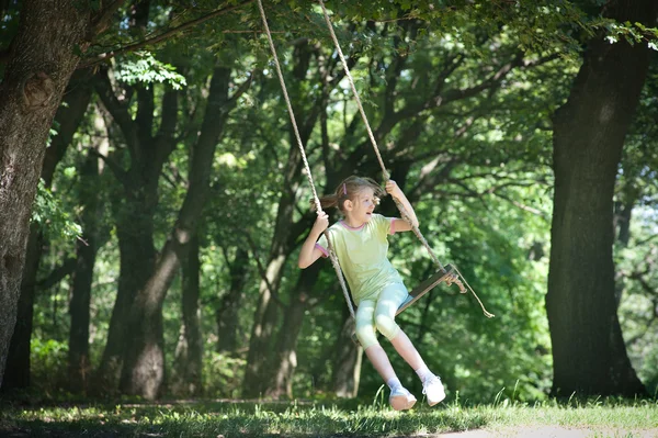 Girl on the swing — Stock Photo, Image