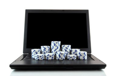 Laptop and white casino chips on keyboard clipart