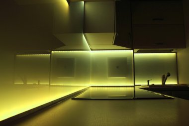 Kitchen with yellow led lighting clipart