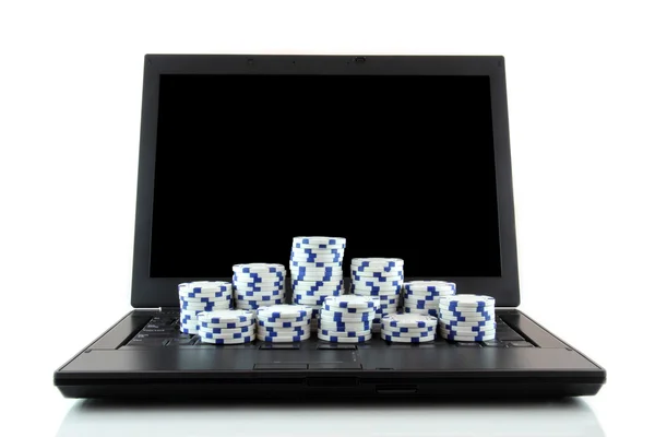 stock image Laptop and white casino chips on keyboard