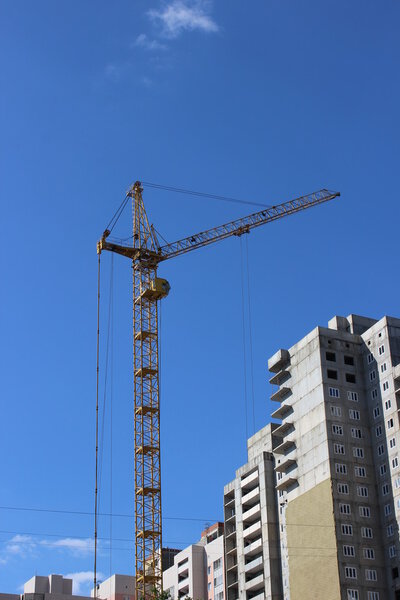Construction of multistory building with a construction crane