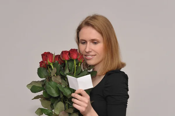 Frau mit Blumen Stockfoto