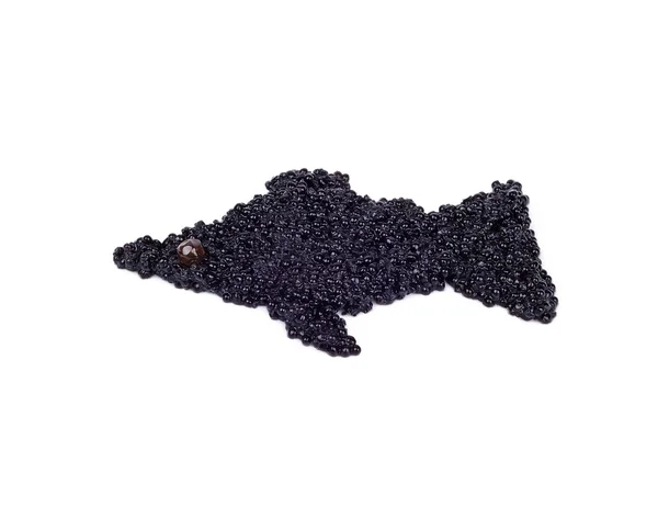 Caviar preto é colocado em vista do peixe — Fotografia de Stock