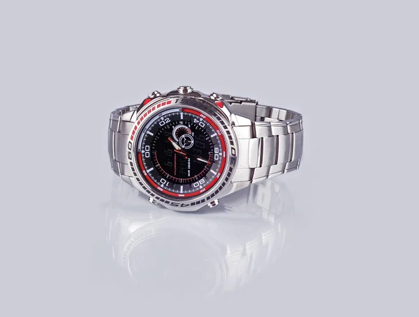 Watch on a grey background with reflection — Stock Photo, Image