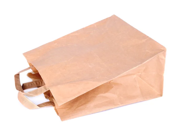 Бумажный пакет на белом фоне — стоковое фото