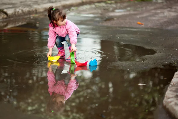 stock image Girl playing in puddle