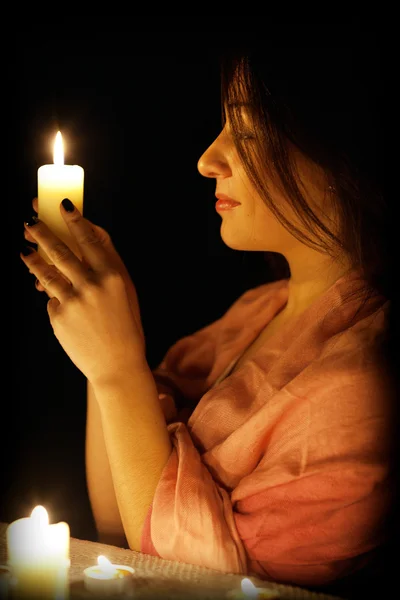 Woman with a candle — Stock Photo, Image