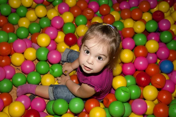 Girl with colorful balls — Stock Photo, Image