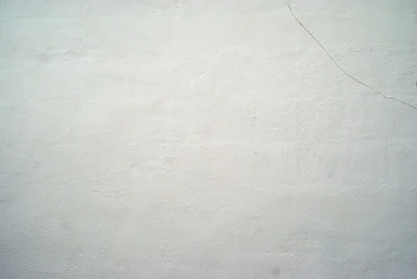 白い壁のテクスチャの背景のひび ストックフォト