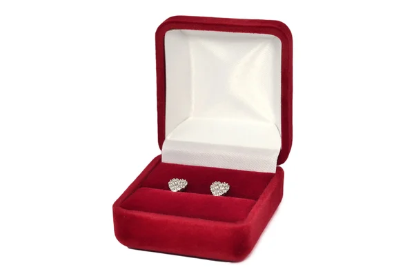 Diamond heart shaped earrings in red jewel box — Stock Photo, Image