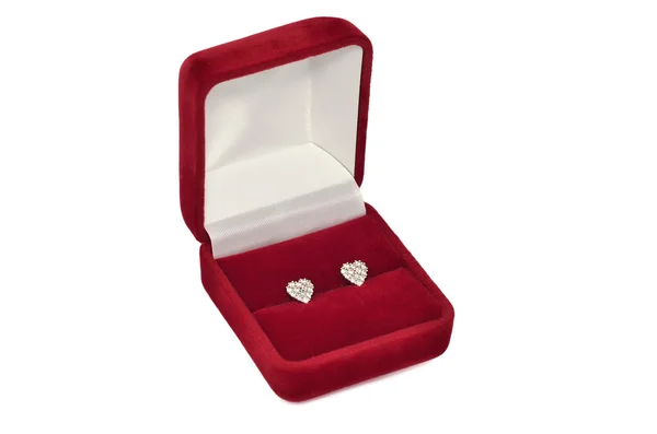 Diamond heart shaped earrings in red jewel box — Stock Photo, Image