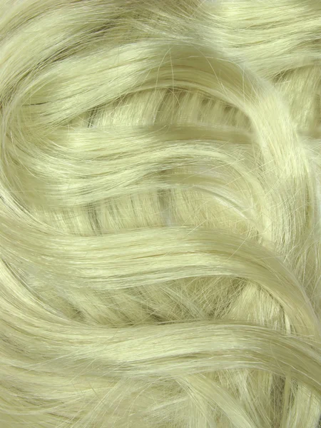 Blond haar krullen als textuur achtergrond — Stockfoto