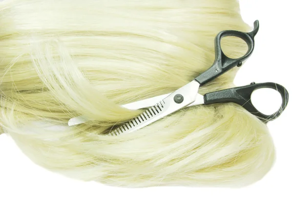 Scissors in blond hair — Stock Photo, Image