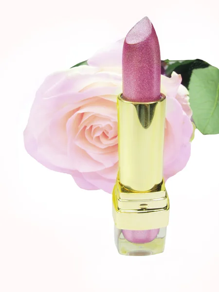 Pink lipstick with rose flower on background — Stock Photo, Image