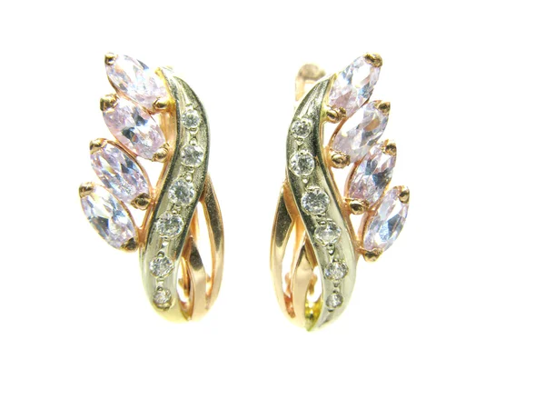 Goldene Ohrringe mit glänzenden Kristallen — Stockfoto