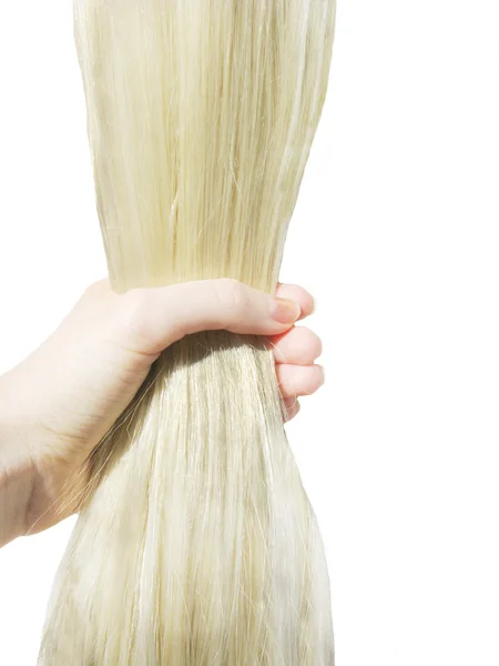 Hand brushing shiny long blond hair — Stock Photo, Image