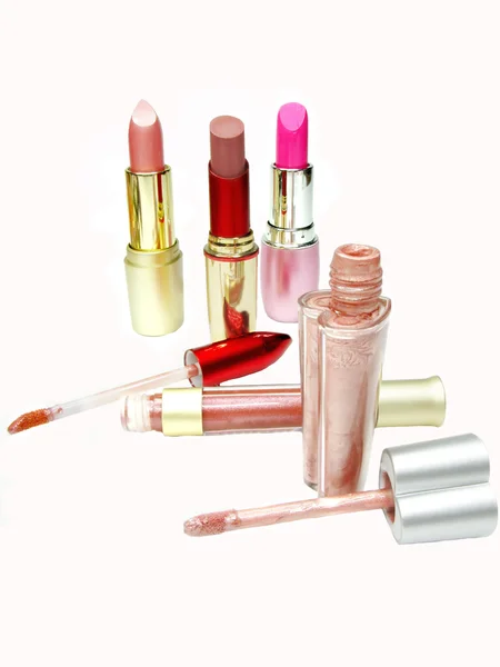 Set of colored lipsticks and lip gloss — Stock Photo, Image
