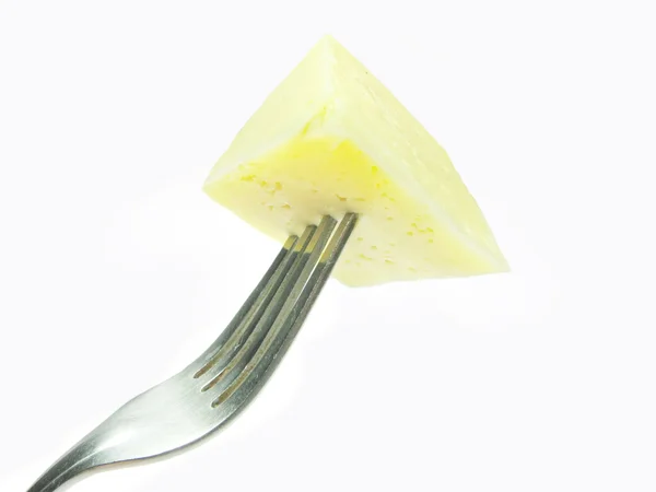 Piece of cheese on fork — Stock Photo, Image