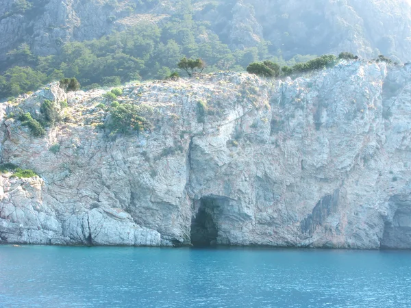 Grotto in rock aefean sea — Stock Photo, Image