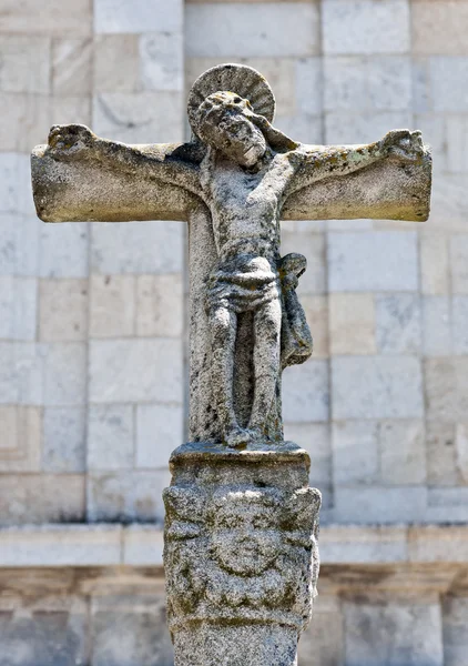 Kors med jesus Kristus i sten Royaltyfria Stockfoton